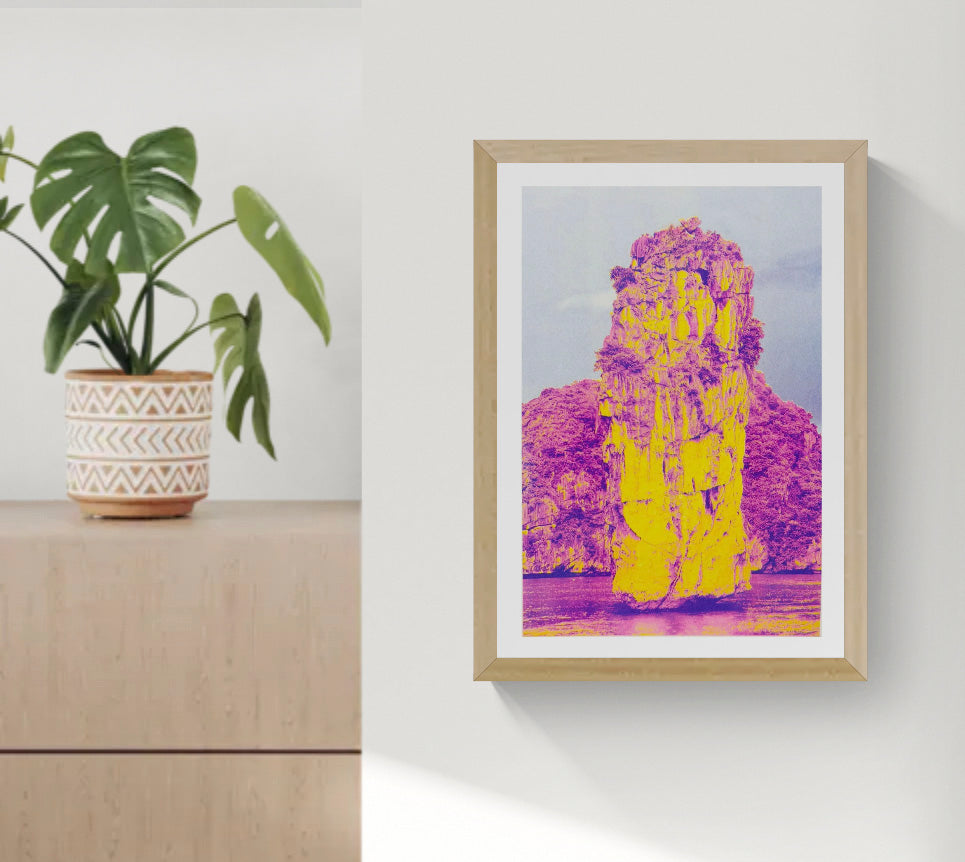 Ha Long Bay risograph art print by PTRVRKD in bold yellow and magenta tones, limited edition A3 poster printed on Munken Pure Rough paper, modern vibrant landscape artwork for home decor, contemporary risograph print made in the Netherlands.