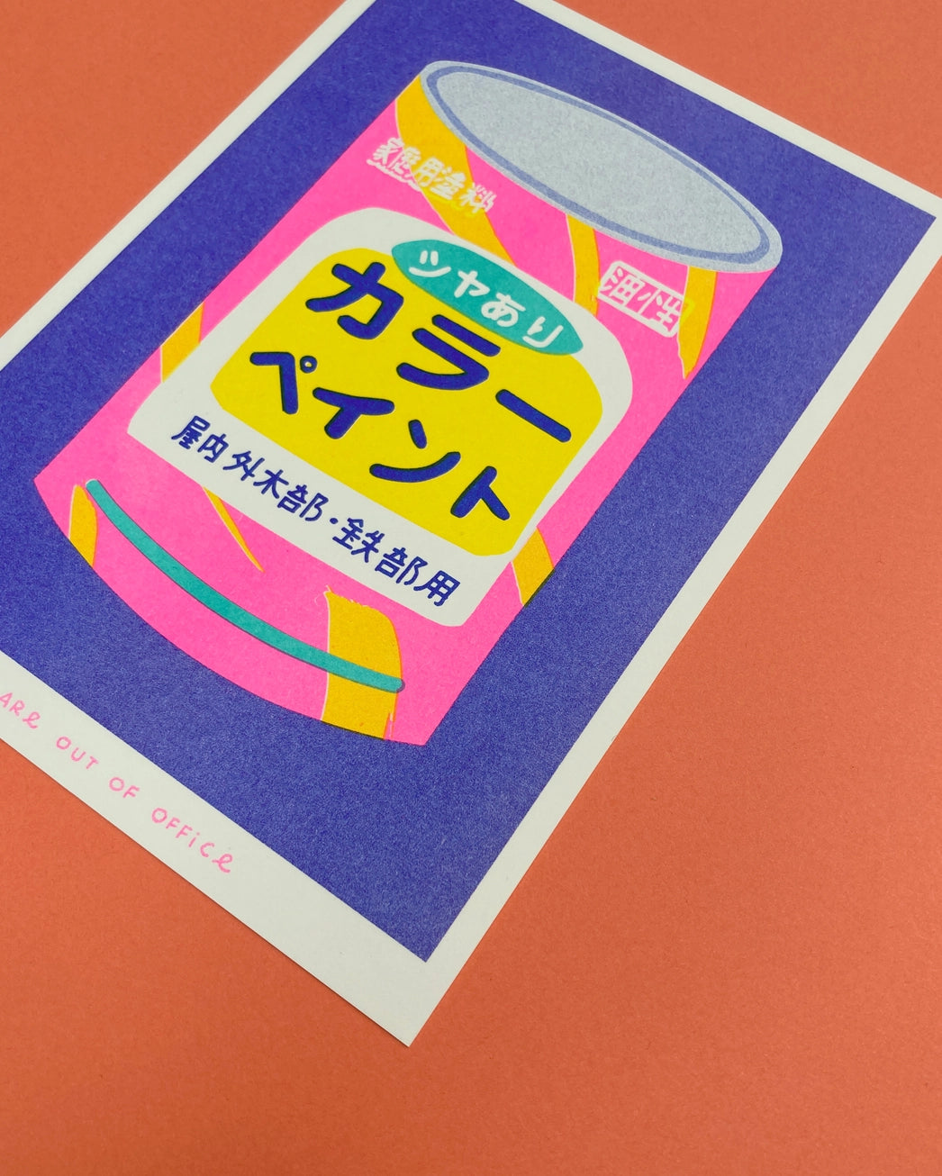 Colorful risograph art print titled Japanese Bucket of Paint by Dutch duo We Are Out Of Office, featuring a retro Japanese paint can in bright fluorescent pink, purple, and yellow tones. Hand-printed with rice-based inks on Biotop 300g paper, perfect for pop art and design lovers.