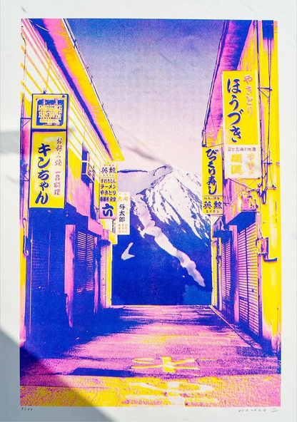 A3 risograph collage print of Fuji Street by PTRVRKD, handmade in vibrant pink, yellow, and blue tones, featuring a Japanese street with Mount Fuji in the background.