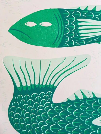 Limited edition risograph art print titled Gill Behaviour by Northern Irish artist Strangford. The artwork features two green fish with expressive eyes, intertwined in a surreal underwater embrace. Printed on recycled A3 paper using linocut and oil-based inks. Edition 56 of 93. Bold, quirky, and handmade—perfect for collectors and lovers of whimsical animal art.