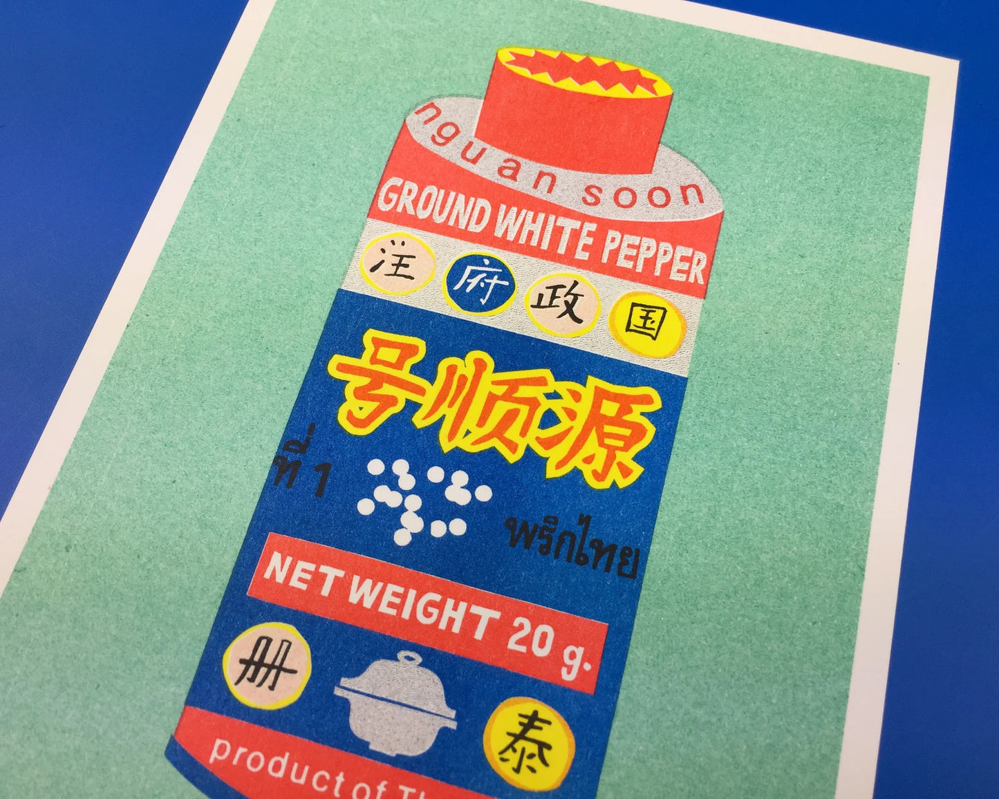 Colorful risograph art print of Thai ground white pepper packaging by We Are Out Of The Office, modern kitchen wall decor on eco-friendly 300g Biotop paper, 13x18 cm