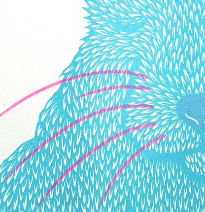 Risograph art print titled Siesta by Strangford, featuring a turquoise blue bunny with pink whiskers curled in a peaceful nap, printed on eco-friendly A3 recycled paper in Northern Ireland.