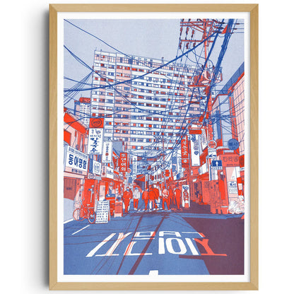 Vibrant risograph print by French illustrator Matthieu Surrel depicting a busy Seoul street filled with power lines, neon signs, and pedestrians, printed in bold red and blue tones on Munken White paper. A3 art print inspired by Myeong-dong’s paper and printing district, perfect for fans of contemporary urban illustration.