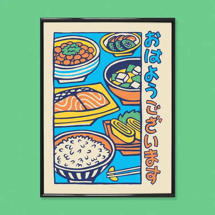 Japanese Breakfast art print by Yeaaah! Studio from the “Umami” collection, depicting miso soup, grilled salmon, rice, tamagoyaki, natto, and pickled vegetables, with the phrase おはようございます (“good morning”) in retro Japanese illustration style. Printed in France on 300g Old Mill Premium White paper, available in 30x40 cm