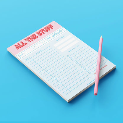 Funny and colorful A5 notepad with bold red and pink lettering, including to-do lists, goals, mood tracker and humorous sections like "Today’s Shit List" – designed by Dutch brand Studio Inktvis and printed in the Netherlands.