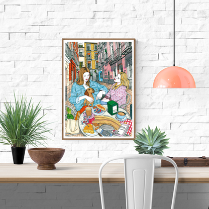 Colourful art print by Spanish illustrator Ana Jarén showing two women enjoying a typical Madrid breakfast with churros, coffee and pastries in the lively Malasaña neighbourhood – 29.7 x 42 cm, perfect wall art to bring Spanish charm to your home.