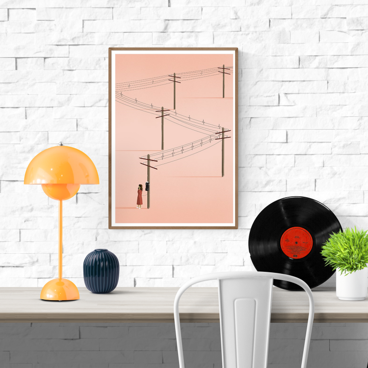 Minimalist art print titled 'Call' by Ana Yael, featuring a woman in a red dress using a vintage telephone on a wooden pole, with telephone wires stretching across a soft pink background – poetic and nostalgic wall art available at Galerie Frits