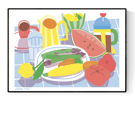 Colorful risograph art print titled Table d'été by Atelier Mio, featuring a still life of summer vegetables and tableware on a tiled surface. Printed on A3 Munken Print White paper in a signed and numbered limited edition of 100. Vibrant kitchen or dining room wall decor with Mediterranean charm.