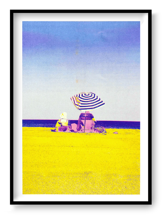Colorful risograph art print titled “Basque Beach” by PTRVRKD, featuring two people sitting under a striped umbrella on a bright yellow beach with a soft blue-purple sky; A3 limited edition printed on Munken Pure Rough paper. Vibrant modern beach artwork ideal for coastal decor and contemporary wall art collectors.