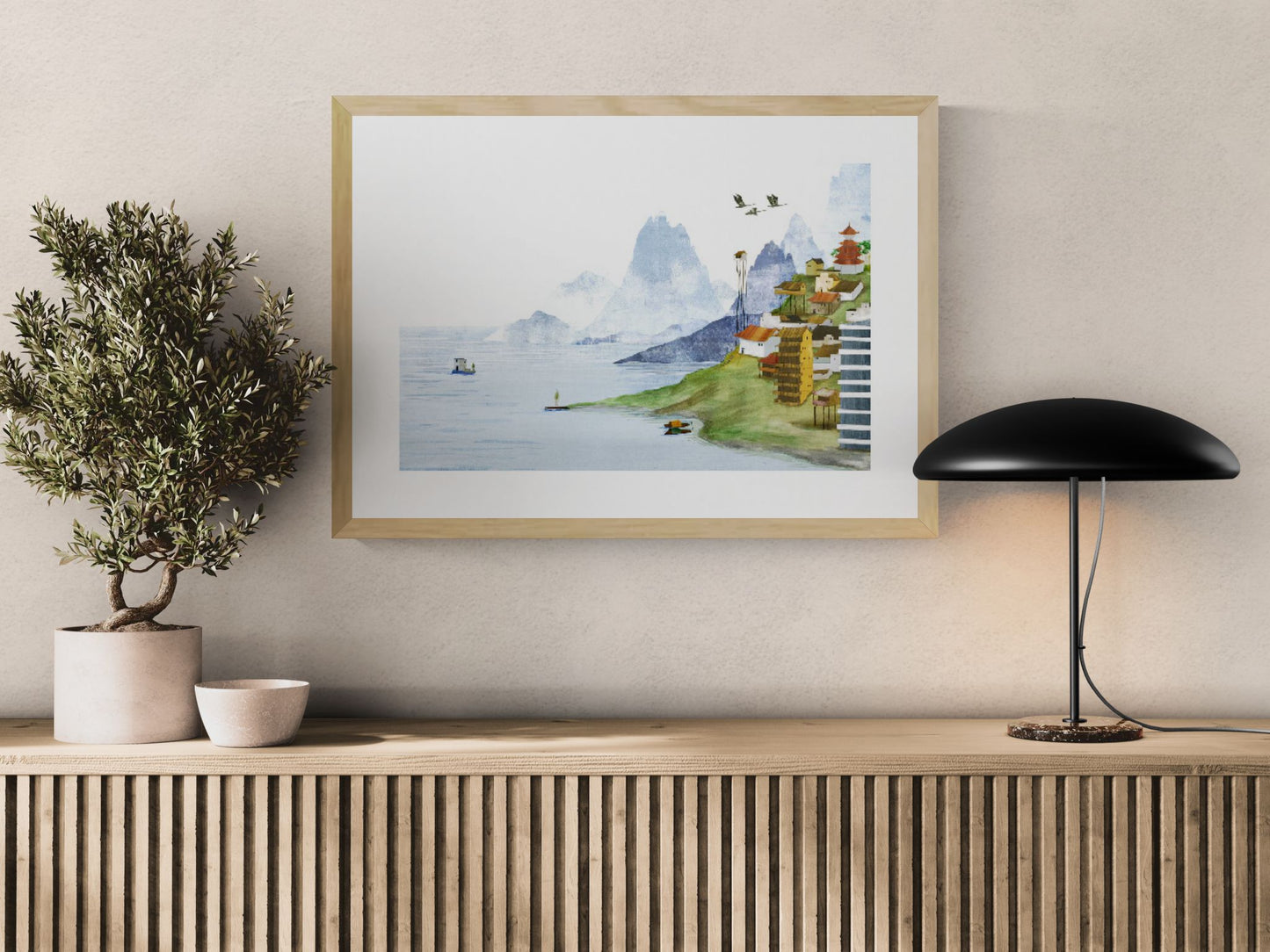 Dreamlike landscape illustration by Rosalien Helsen featuring a quiet lakeside village, misty blue mountains, boats, and flying birds. Acrylic painting combined with digital collage in landscape format, ideal for peaceful contemporary home decor.
