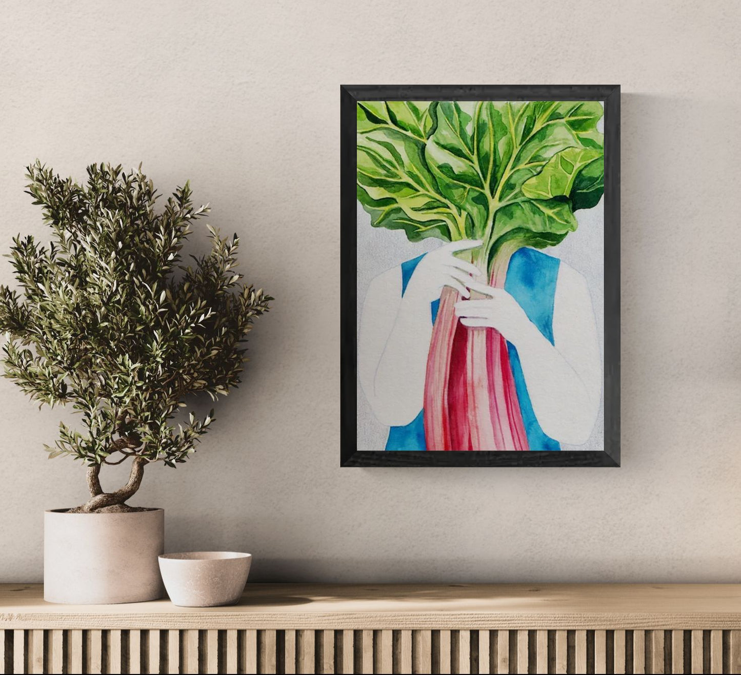 Surreal watercolor illustration of a person holding vibrant rhubarb leaves in front of their face, printed as a vertical giclée art print in rich green, pink, and blue tones, ideal for kitchen wall art and contemporary home décor.