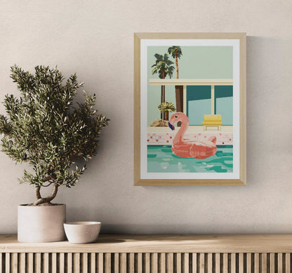 Colourful vertical digital art print showing a large pink flamingo pool float in turquoise water, surrounded by palm trees and retro architecture, ideal for playful living room or bedroom decor.