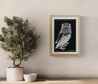 Vertical black-and-white digital art print of two stylised owls by Julie de Graag, based on a 1921 woodcut, with bold graphic lines for study, hallway, or living room wall decor.