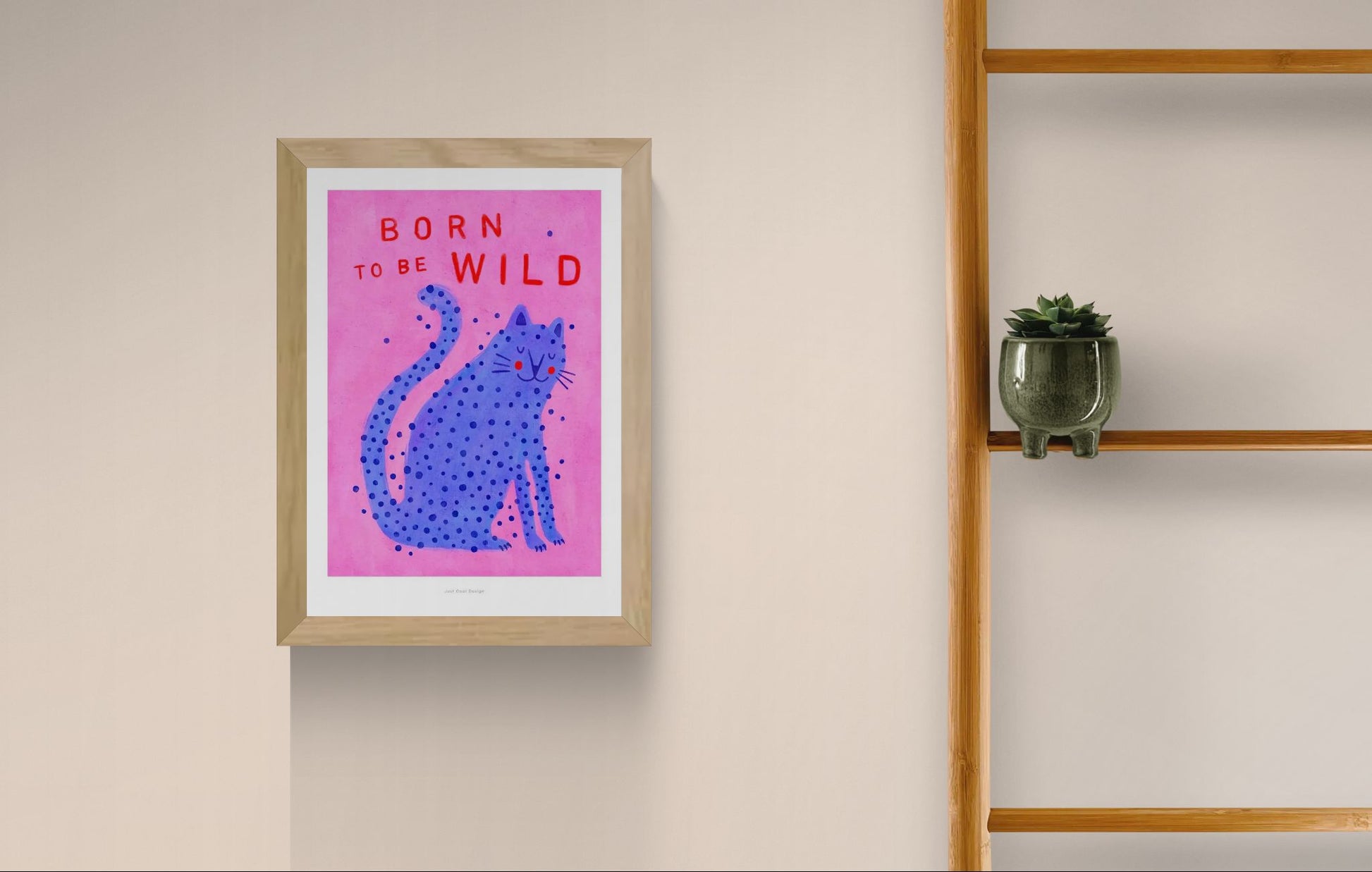 Born to Be Wild cat illustration by Just Cool Design – playful modern art print featuring a blue spotted cat on a pink background with bold red typography, fun and quirky wall art for cat lovers and vibrant interiors, available at Galerie Frits