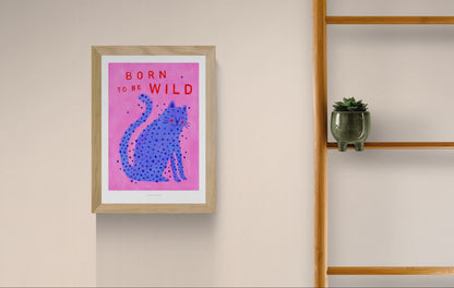 Born to Be Wild cat illustration by Just Cool Design – playful modern art print featuring a blue spotted cat on a pink background with bold red typography, fun and quirky wall art for cat lovers and vibrant interiors, available at Galerie Frits