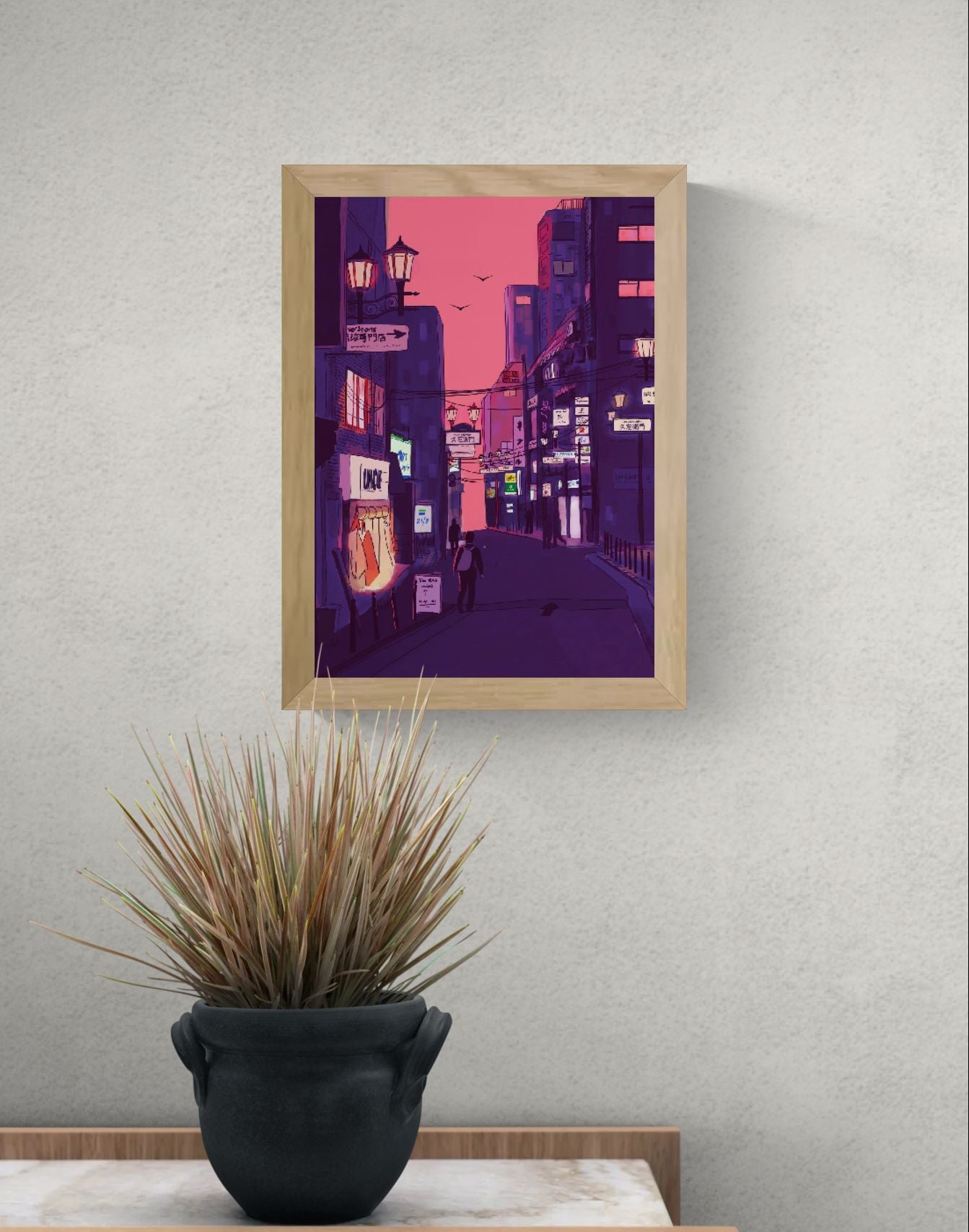 Fine art giclée print titled “Nights in Japan” by Valeria Maggiani featuring a cinematic Japanese city street at dusk with neon signs, warm shop lights, urban silhouettes, and a pink-purple evening sky, printed on 100% cotton textured paper A4 size, ideal for modern home decor and contemporary wall art in Belgium and Europe.