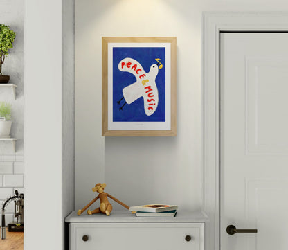Colorful art print of a white pigeon carrying a yellow musical note on a deep blue background with the hand-painted phrase “Peace & Music” in red and yellow letters. Whimsical and modern illustration by Just Cool Design, perfect wall art for music lovers and optimistic interiors.