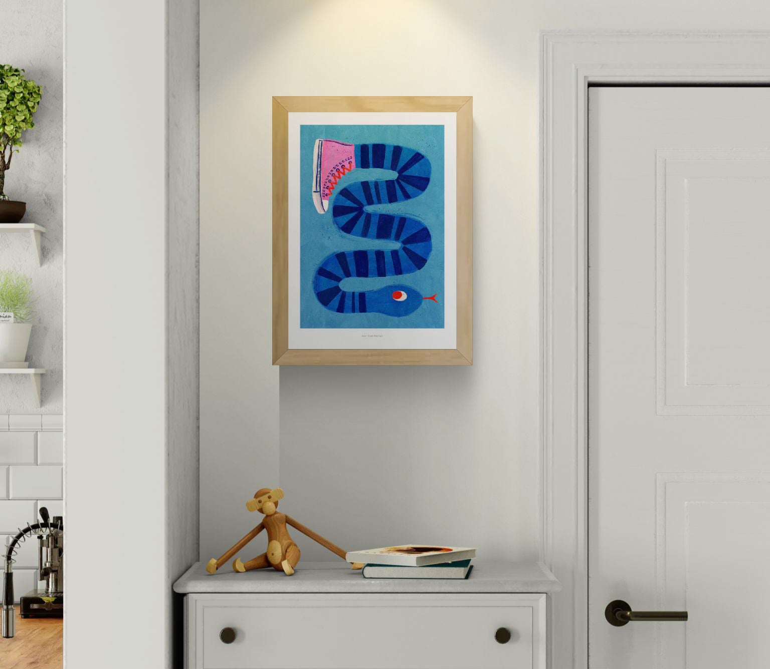 Colorful surreal illustration print by Just Cool Design featuring a long blue striped snake wearing a single pink sneaker, set against a bright blue background. Modern, quirky wall art for playful interiors and design lovers.