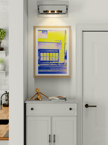 Limited edition A3 risograph print by PTRVRKD depicting a minimalist Kyoto house front in bold neon yellow and deep blue tones, Japanese architectural details, modern graphic style, contemporary wall art for home decor, perfect for Japan lovers and design enthusiasts.