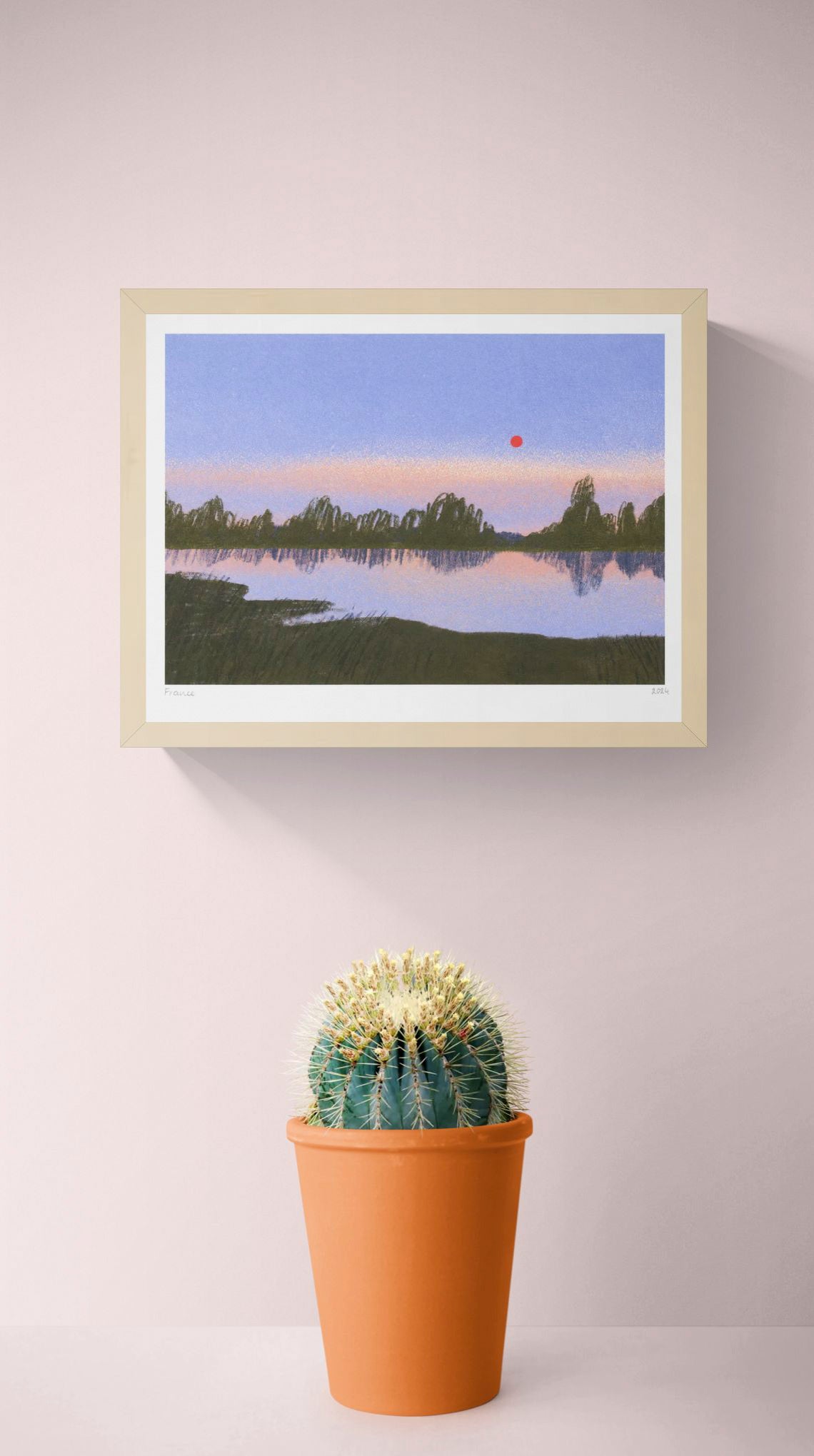 France by Linde Raats, horizontal giclée print of a quiet lake at dusk with violet sky, dark green trees, soft reflections and a red sun, ideal for calm bedroom or living room wall decor.