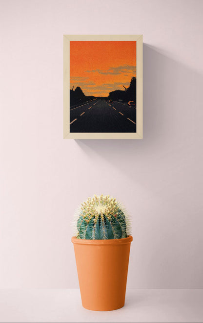 Vertical giclée art print showing cars driving along a dark motorway beneath a vivid orange sunset, with textured clouds and black tree silhouettes, ideal for modern hallway, office or gallery wall decor.