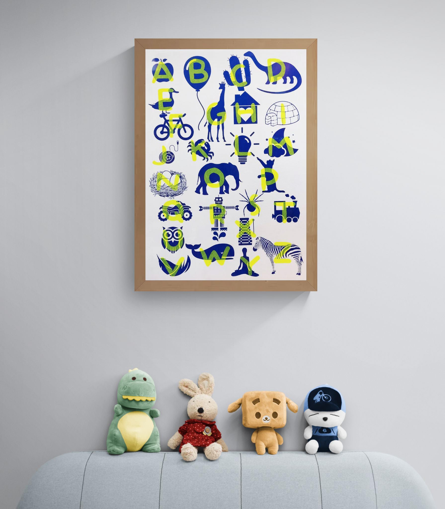 Playful and educational alphabet poster by De Zeverij featuring bold letters paired with charming red-blue or blue-yellow illustrations of animals, objects, and everyday items. Designed in a fun, screen-printed style perfect for children's rooms, classrooms, or creative spaces—an eye-catching blend of learning and modern design