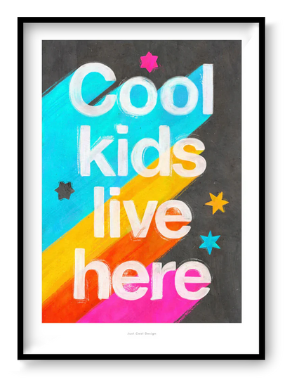 Giclée art print by Just Cool Design with the phrase "Cool kids live here" in bold white letters over a bright rainbow background with stars, ideal for colorful children's rooms or playful modern decor.