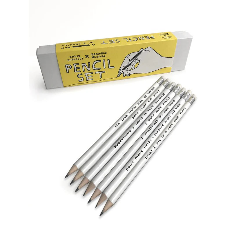 David Shrigley pencil set with 7 silver HB pencils in a yellow gift box, each featuring a humorous phrase by the British artist—ideal creative gift made in the UK for fans of quirky art and stationery.