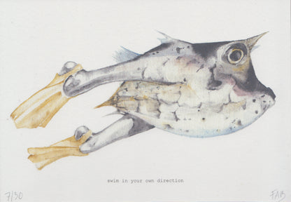Surreal A5 art print titled Swim in your own direction by Belgian illustrator FAB. Features a watercolor fish with human legs and yellow fins, paired with the quote "Swim in your own direction". Printed on 300g Munker Pure rough paper, ideal for unique and inspirational home decor.