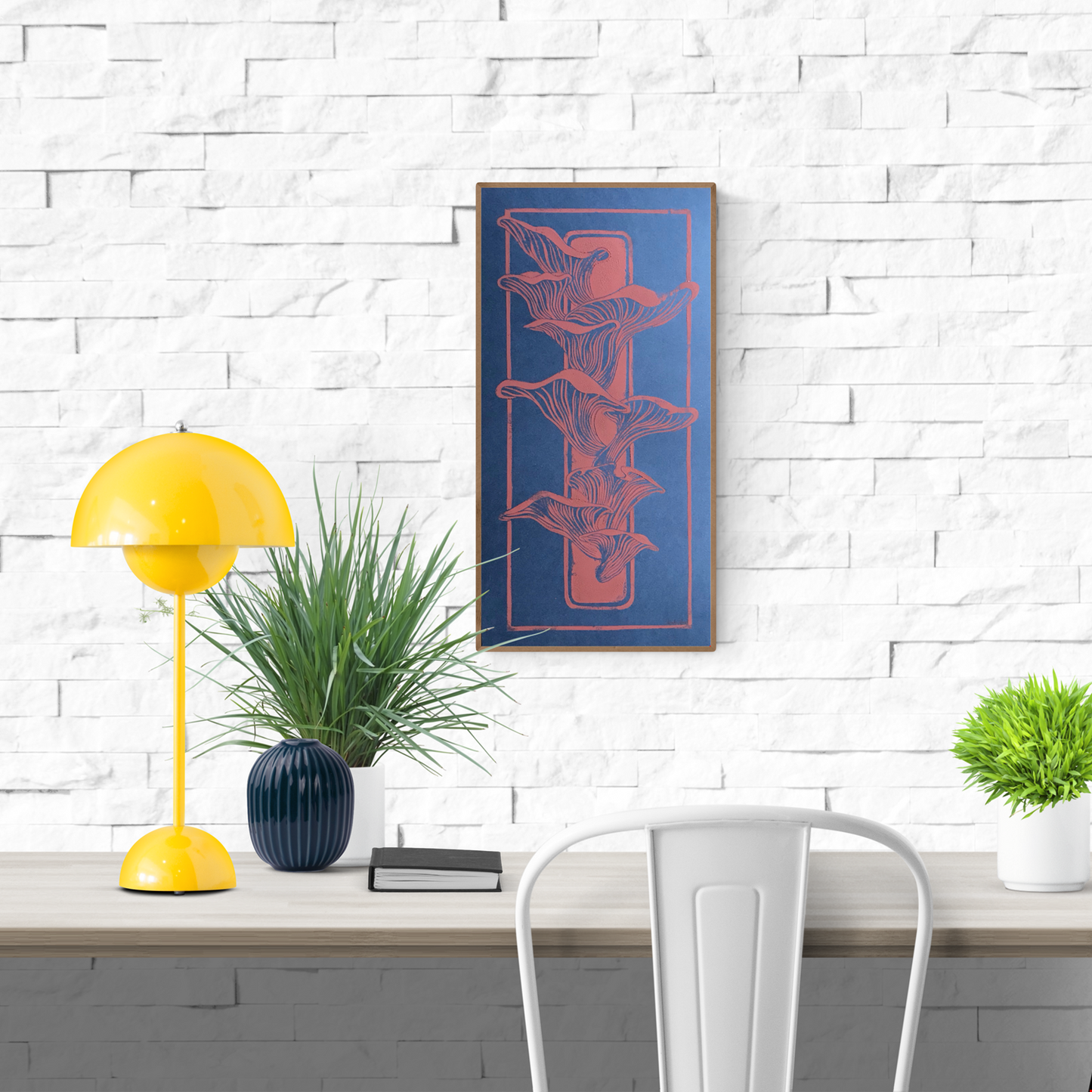 Handmade linocut print of coral-colored mushrooms growing from a piece of wood on a deep blue background; organic nature-inspired artwork, 25.5 x 50 cm by Belgian artist Leda Vaes.