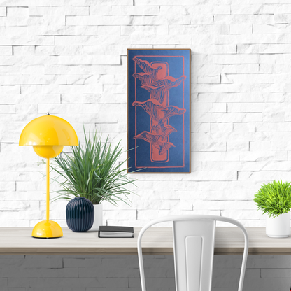 Handmade linocut print of coral-colored mushrooms growing from a piece of wood on a deep blue background; organic nature-inspired artwork, 25.5 x 50 cm by Belgian artist Leda Vaes.