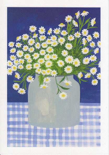 Hand-illustrated art print titled “Daisies” by Belgian artist Leens, featuring a lush bouquet of white daisies with yellow centers in a transparent jar, placed on a blue gingham tablecloth with a deep blue background. Printed on A4 textured fine art paper.