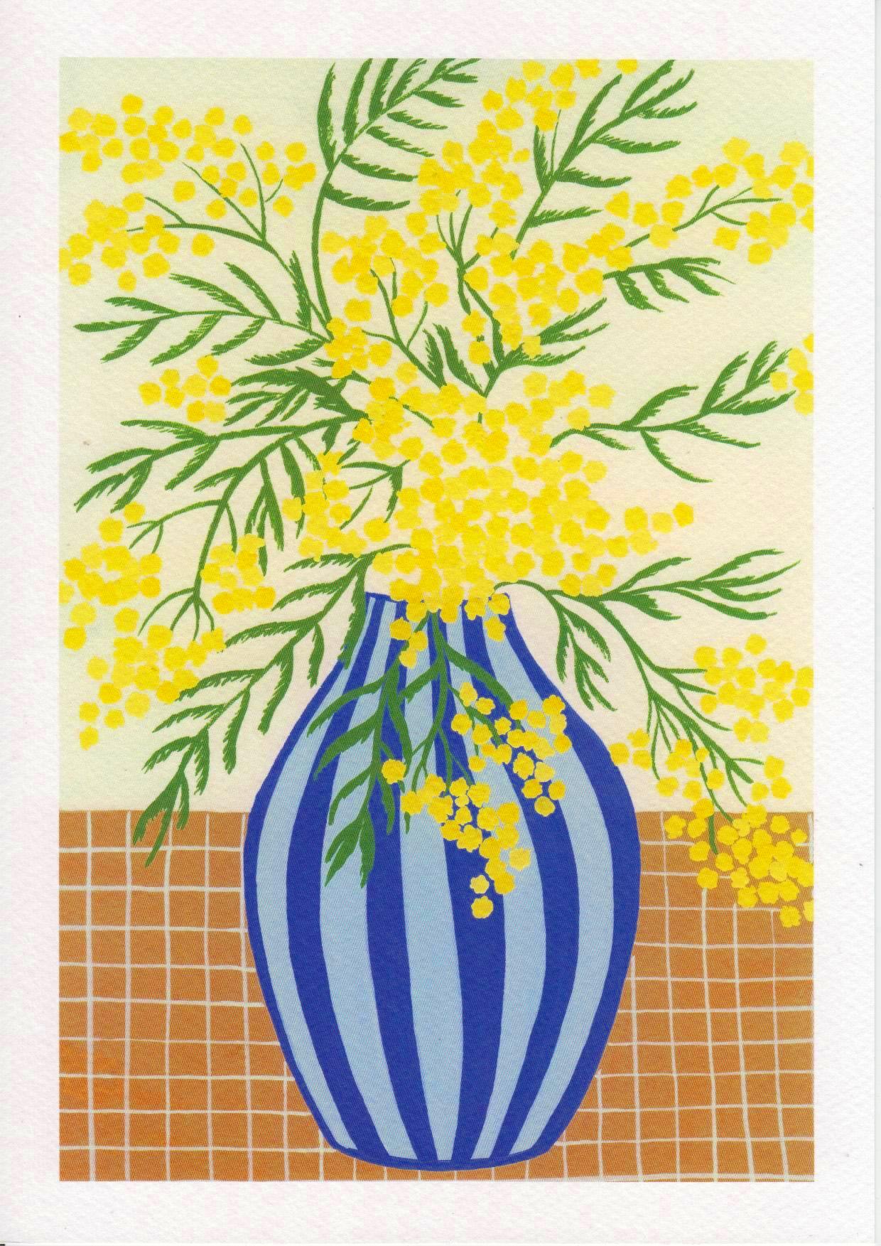 Botanical digital art print titled “Mimosa” by Belgian illustrator Leens, featuring vibrant yellow mimosa flowers in a blue striped vase on a tiled table, printed on textured fine art paper in A4 size.