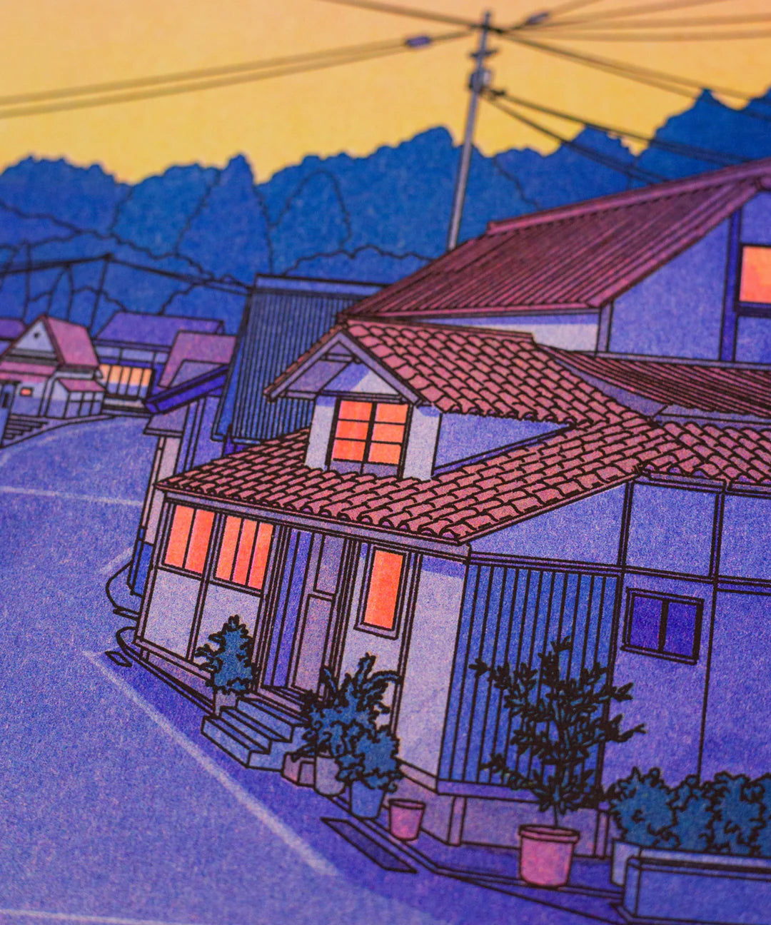 “Nowhere in Japan” risograph print by Liam Cobb – A3 art print showing a calm Japanese suburban street at sunset with pink, purple, and yellow hues, power lines above, and a cat in the foreground. Retro-inspired color palette, cinematic light, and detailed linework create a nostalgic and poetic atmosphere. Perfect for lovers of Japanese urban scenery and modern illustration.