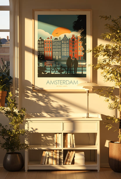 Colorful Amsterdam travel poster by Studio Inception featuring canal houses at sunset, a couple by the water, and a bicycle silhouette. Modern wall art print evoking Dutch architecture, romance, and vibrant city life.