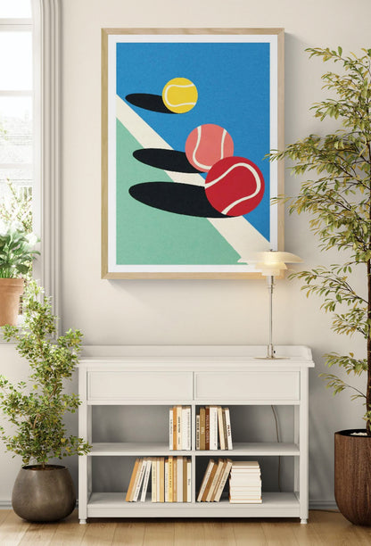 Minimalist art print 3 Tennis Balls by Rosi Feist — a vibrant digital illustration featuring three tennis balls in red, yellow, and pink with bold shadows on a blue and green court. Perfect contemporary wall art for sport lovers and modern design enthusiasts, 50 x 70 cm high-quality digital print.