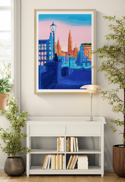 Vertical giclée art print by Valeria Maggiani showing a colourful view towards Antwerp Cathedral, with a seated black cat, deep blue streets and a pink sky, ideal for contemporary wall decor.
