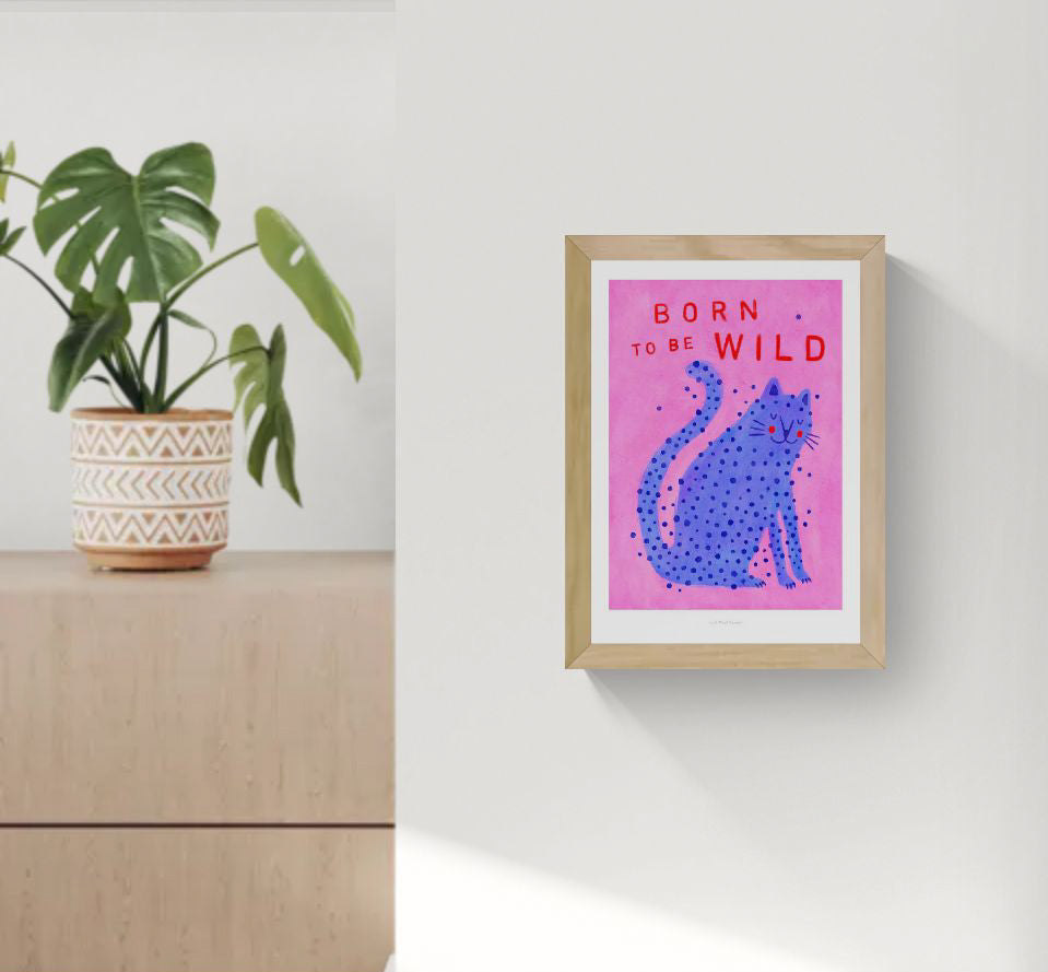 Born to Be Wild cat illustration by Just Cool Design – playful modern art print featuring a blue spotted cat on a pink background with bold red typography, fun and quirky wall art for cat lovers and vibrant interiors, available at Galerie Frits