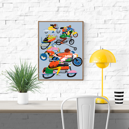 Colorful giclée art print by Miguel Manich featuring dynamic women riding motorcycles in vivid pink, yellow, green, and blue tones on a soft blue background, celebrating speed and freedom.