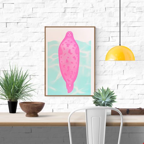 Humorous pink seal risoprint titled "Seal of Disapproval" by Strangford, featuring a bold stylized animal floating over a turquoise water background in A3 size.