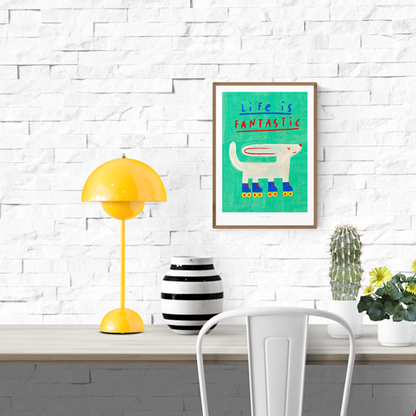 Cheerful art print of a white dog wearing colorful roller skates with the quote “Life is Fantastic” in playful typography on a turquoise background – illustrated by Just Cool Design.