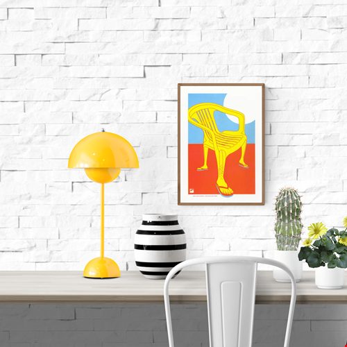 Bold risograph print of a yellow plastic chair with human legs in flip-flops against a red and blue background – No Place like Home by VrijFormaat, A4 art print from the Seat for Thought series.