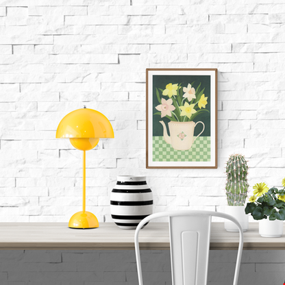 “Daffodils” by Belgian illustrator Leens – a botanical A4 digital print featuring a pastel floral teapot filled with yellow and pink daffodils, placed on a green checkered tablecloth with a dark green background.
