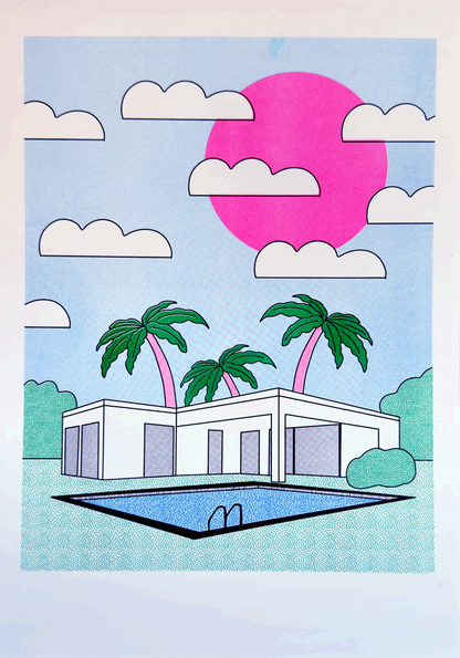 A3 risograph art print titled Palm Springs by Belgian illustrator Studio Stoutpoep. Features a retro white villa with palm trees, a blue pool, and a bold pink sun in a surreal Californian landscape. Printed on recycled paper in Belgium.