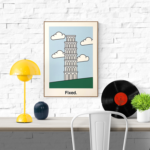 Minimalist risograph art print by Studio Stoutpoep titled “Fixed,” featuring a digitally corrected version of the Leaning Tower of Pisa standing upright against a light blue sky with clouds. A2 size, eco-friendly ink, made in Belgium.
