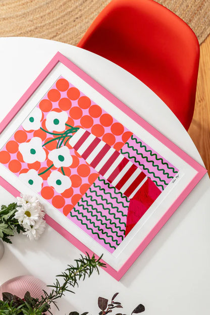 Colorful A4 Giclée print by Portuguese illustrator Teresa Rego – bold striped vase with playful white flowers, red, pink and green graphic patterns, printed on 315 gsm acid-free, 100% cotton fine art paper with pigment-based inks – vibrant botanical wall art for modern interiors.