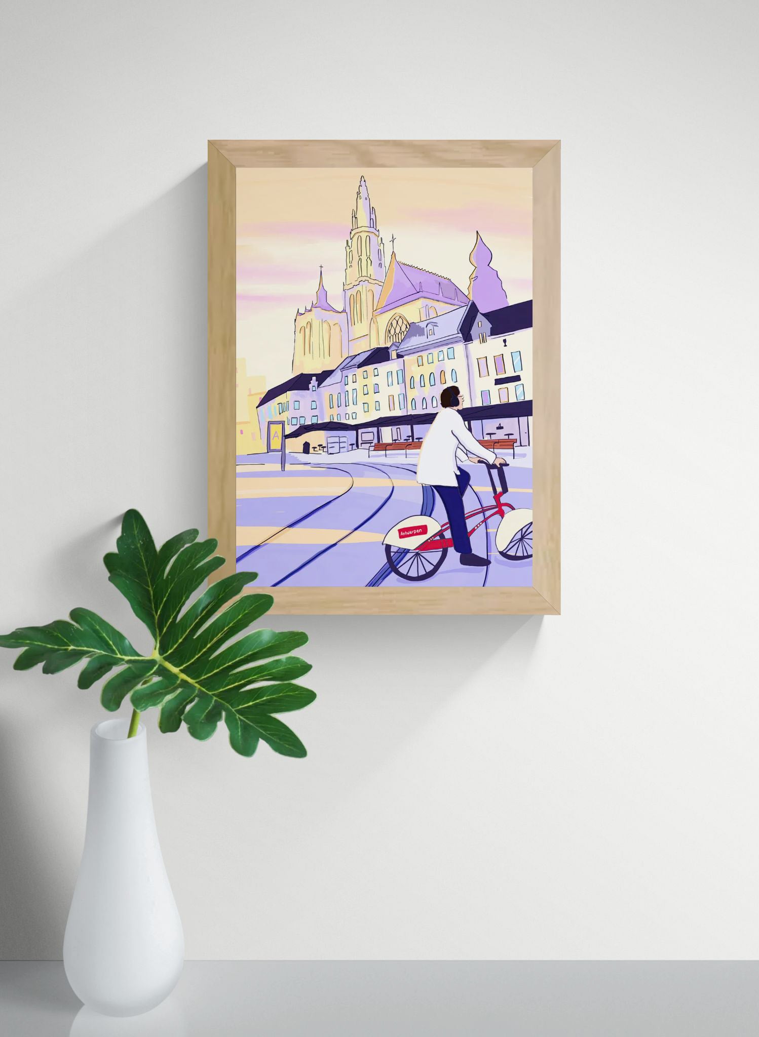 A4 Fine Art Giclée print “Bike Rides and a Little Sun” by Valeria Maggiani featuring Antwerp Cathedral and a rider on the official Antwerp Velo bike at sunset, contemporary European city illustration printed on 100% cotton 310 gsm textured paper with archival pigment inks.