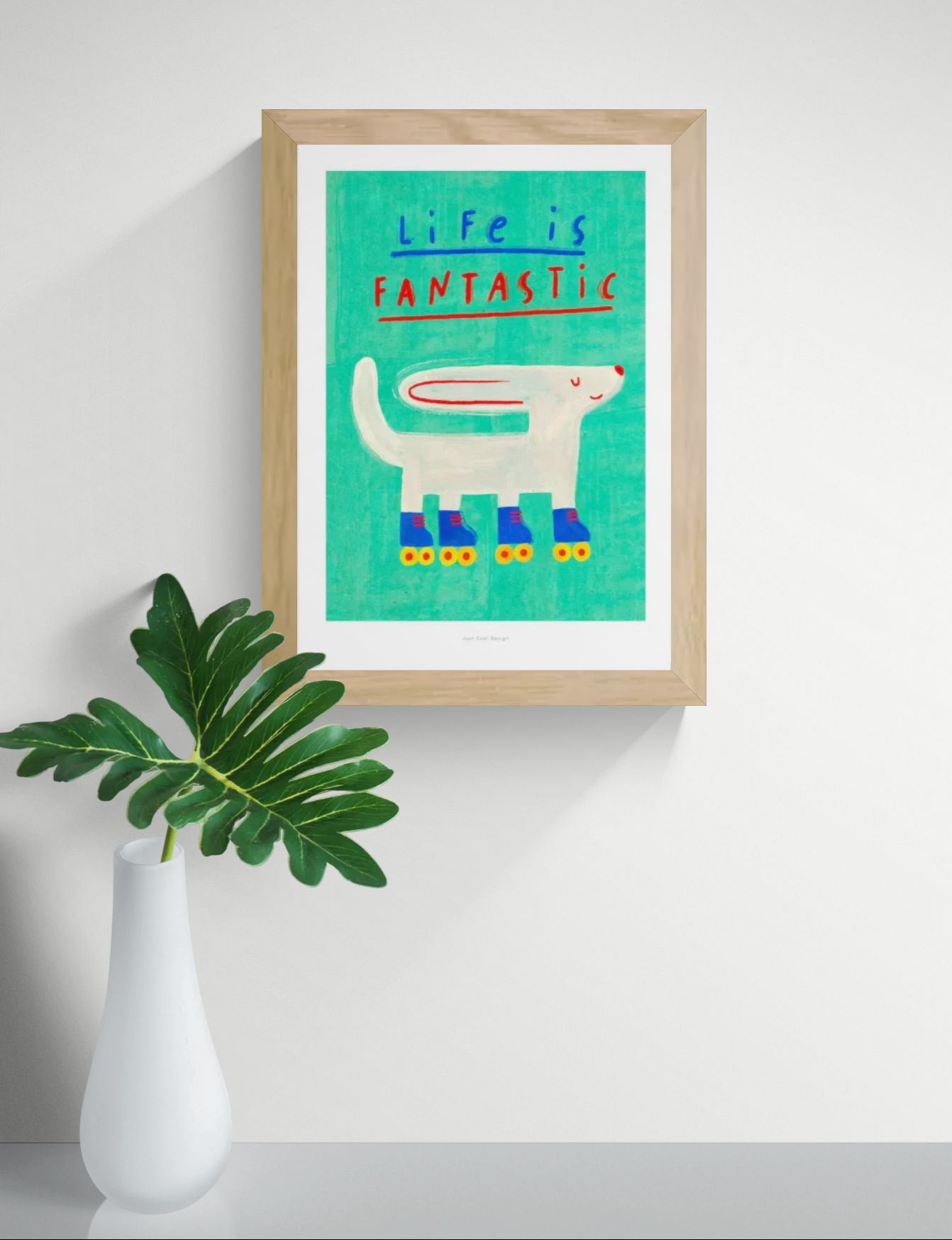 Colorful “Life is Fantastic” motivational art print by Just Cool Design featuring a playful white dog on roller skates against a turquoise background, A4 giclée wall art illustration for modern home decor.