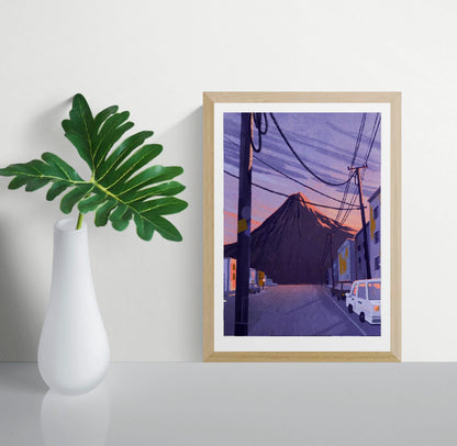 Illustration by Linde Raats showing Mt Pico volcano towering behind a quiet urban street at sunset, with deep purples, soft orange hues, and power lines cutting through the scene – 21x29.7 cm giclée print perfect for dramatic modern interiors
