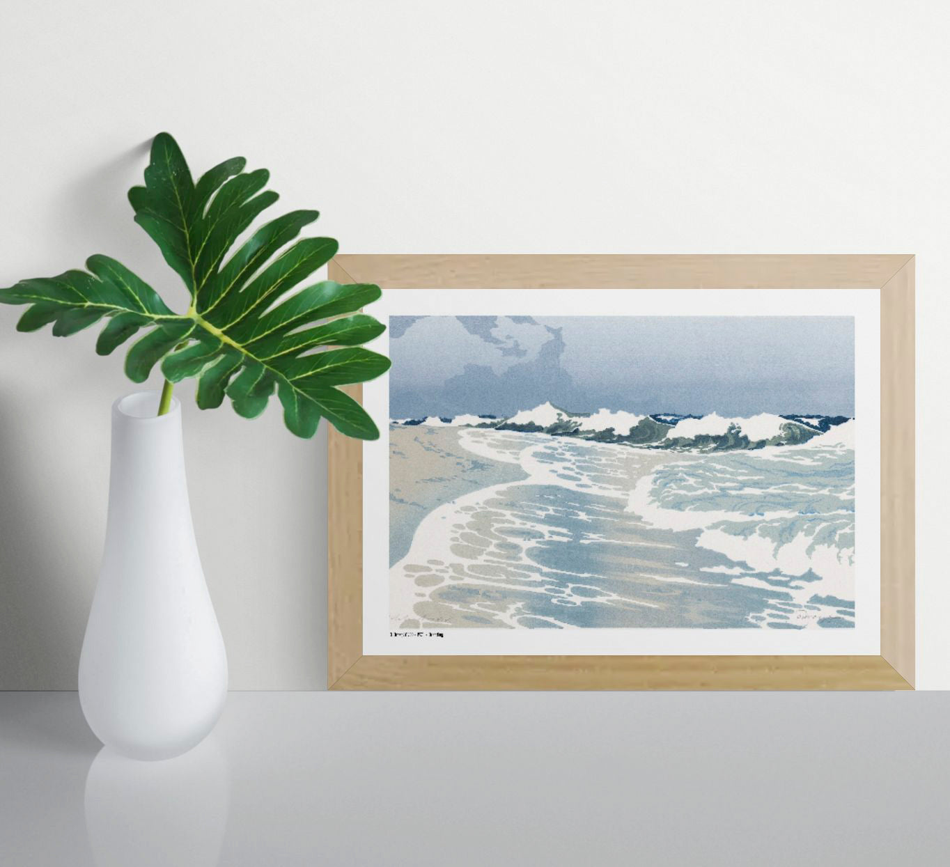 Horizontal coastal art print showing rolling ocean waves, white sea foam and a pale blue sky in a vintage colour woodcut style, ideal for calm living room, bedroom or coastal wall decor.